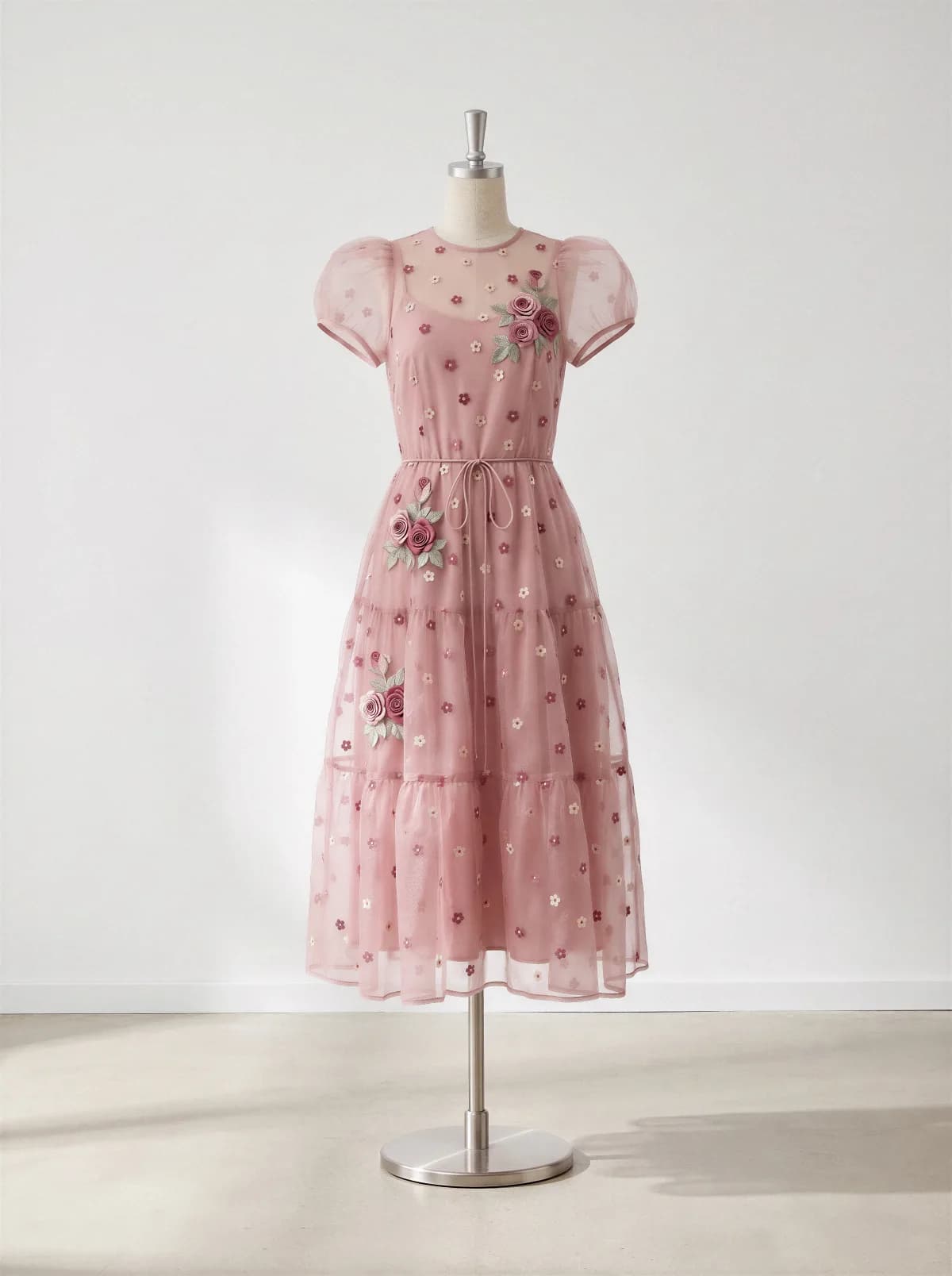 Product photo: the front of a pink embroidered dress on a mannequin