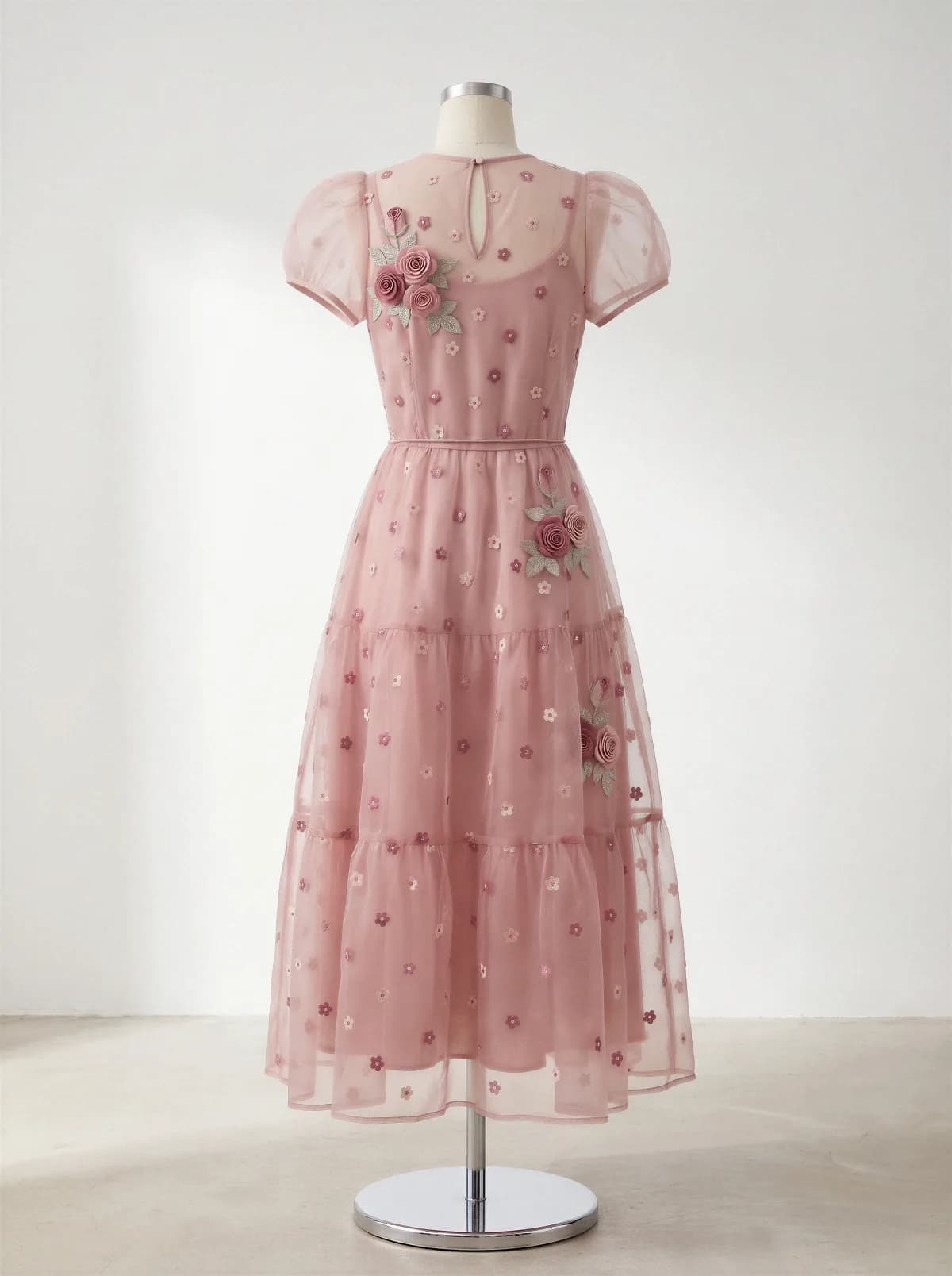 Product photo: the back of the same pink embroidered dress on a mannequin