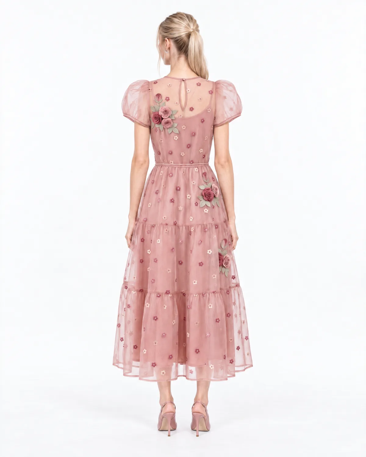 Back view of the same model in the pink dress