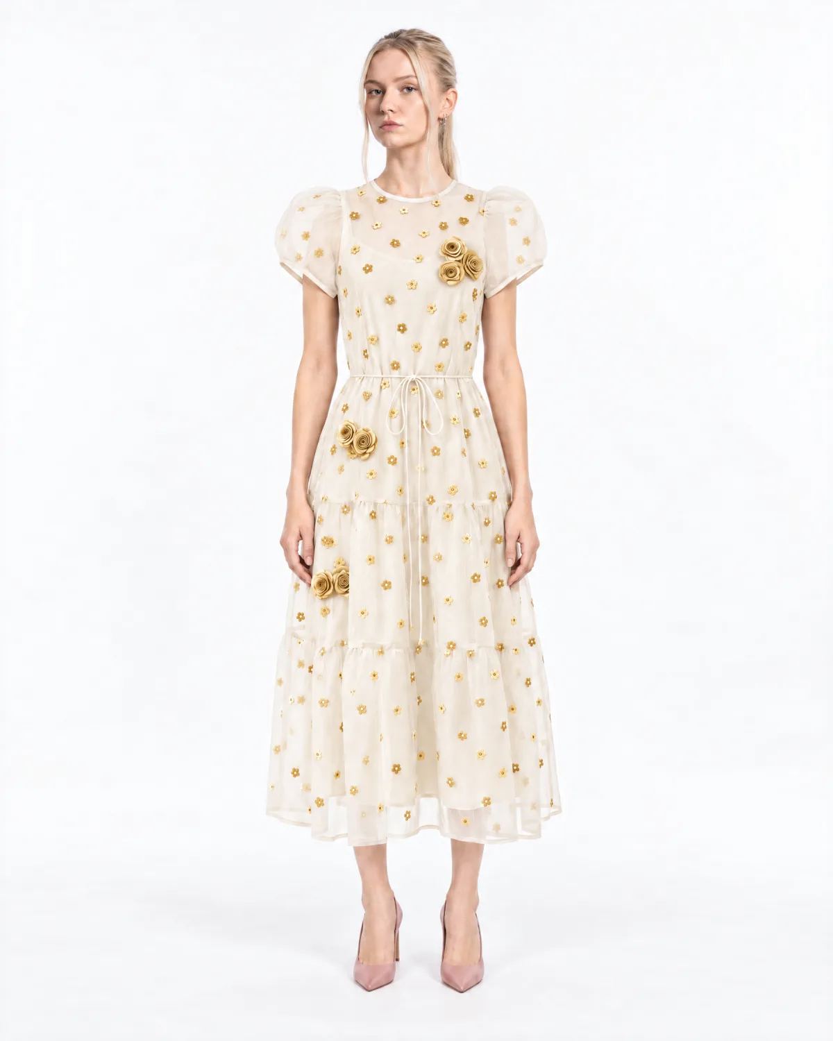 Front view of the same model in the dress, now ivory with gold flowers