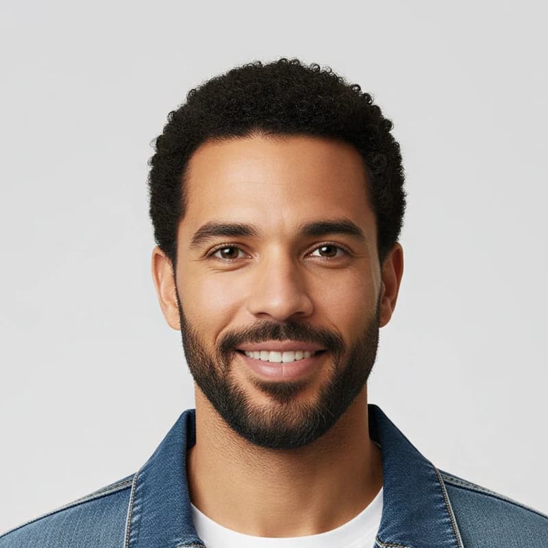 The same close up upscaled 2×: natural skin texture, defined curls, and a sharp beard