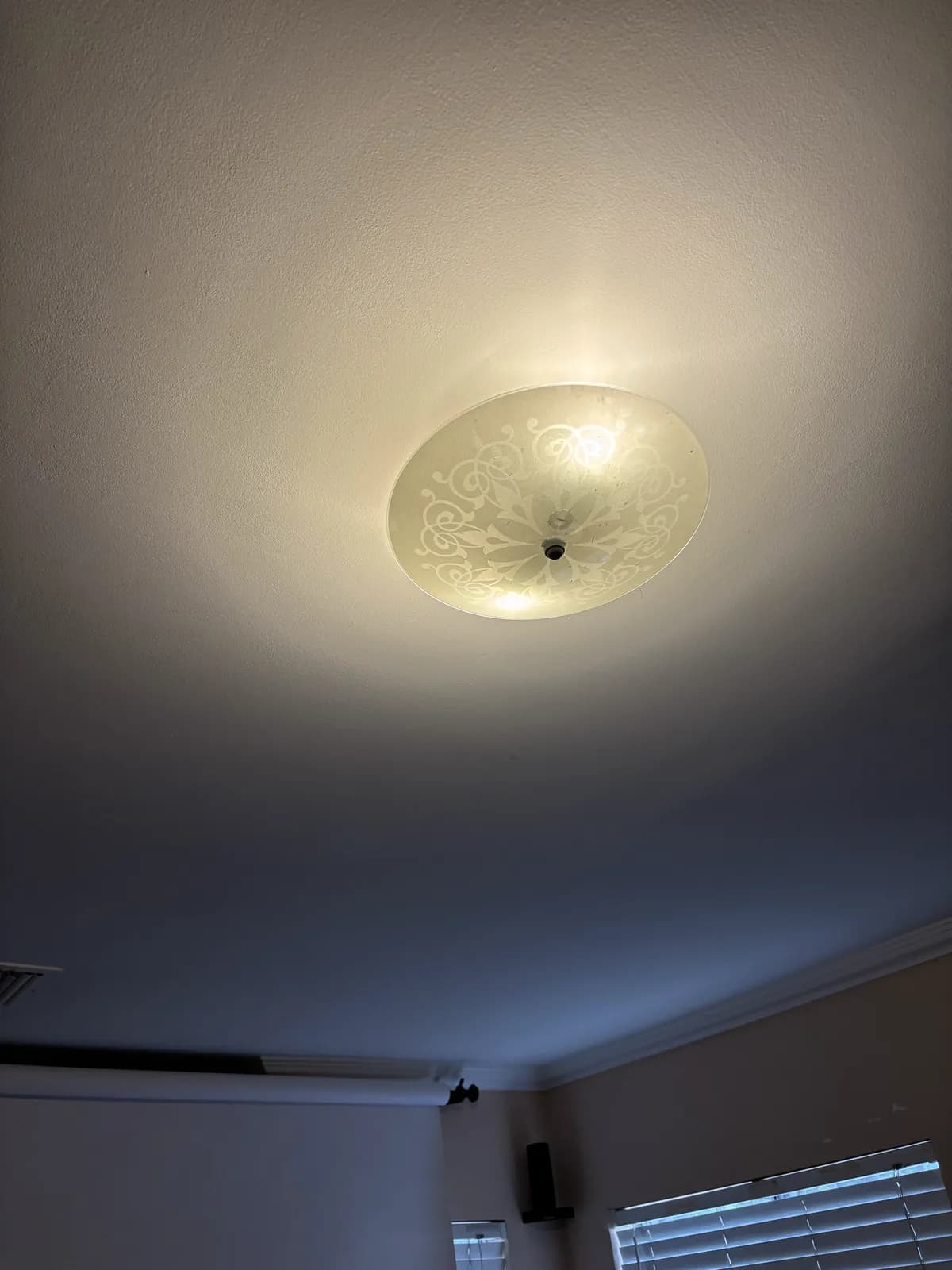 A ceiling light with warm yellow bulbs