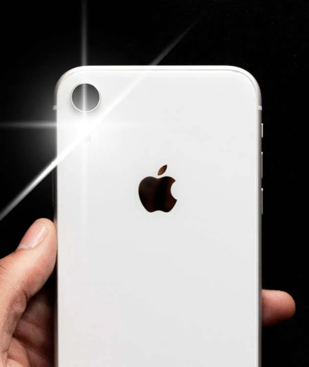 The flash on the back of a phone, turned on