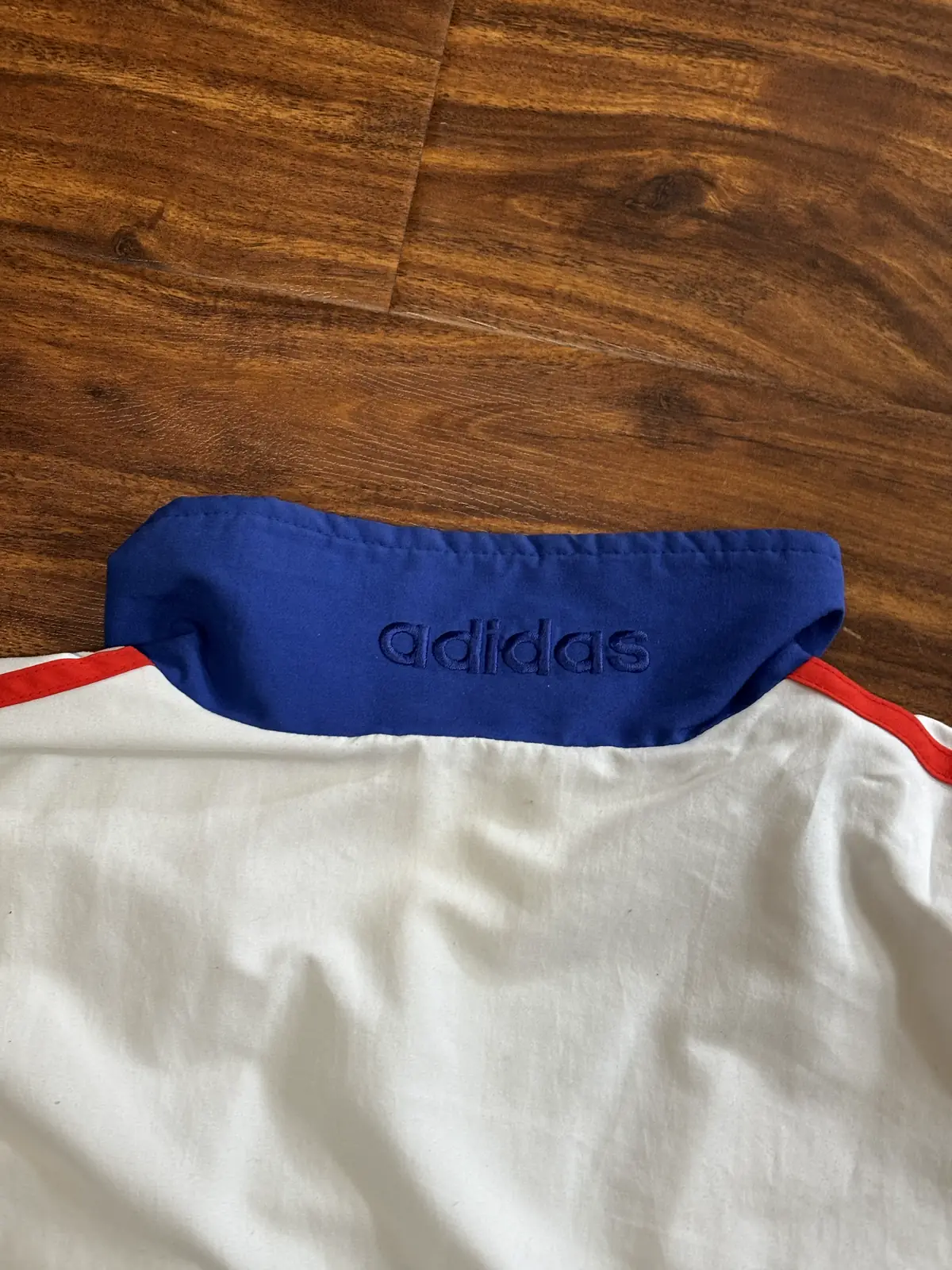 Close up of the word stitched on the back of the collar, laid flat