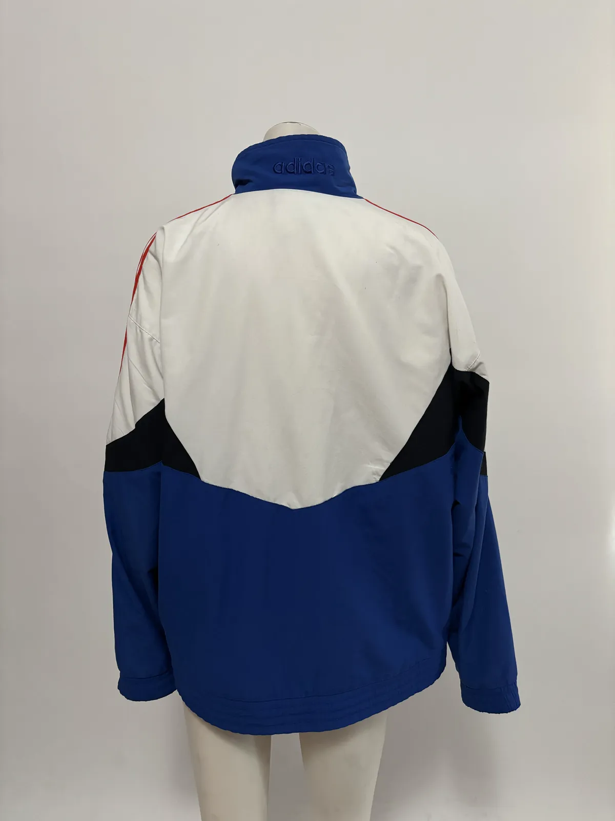 Product photo: the back of the track jacket on a mannequin