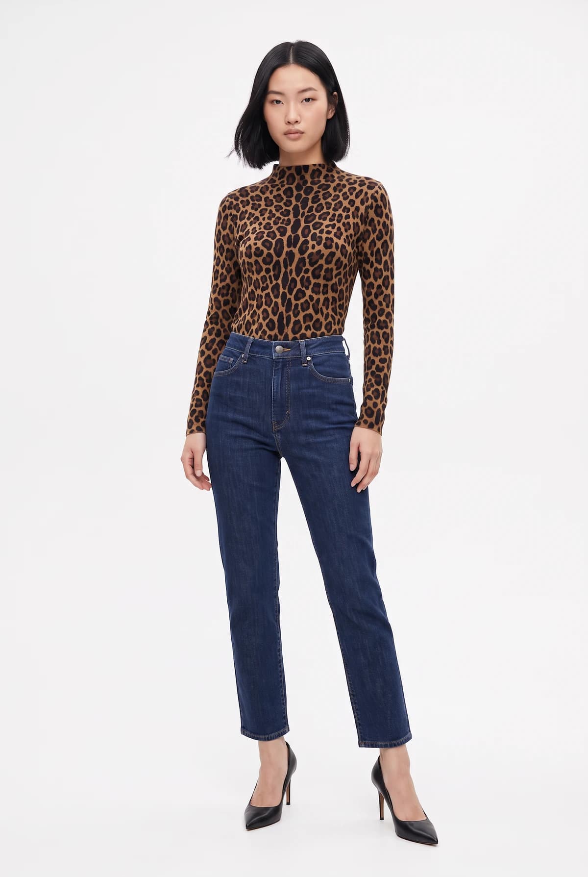 The model wearing the leopard print top with her original jeans and heels
