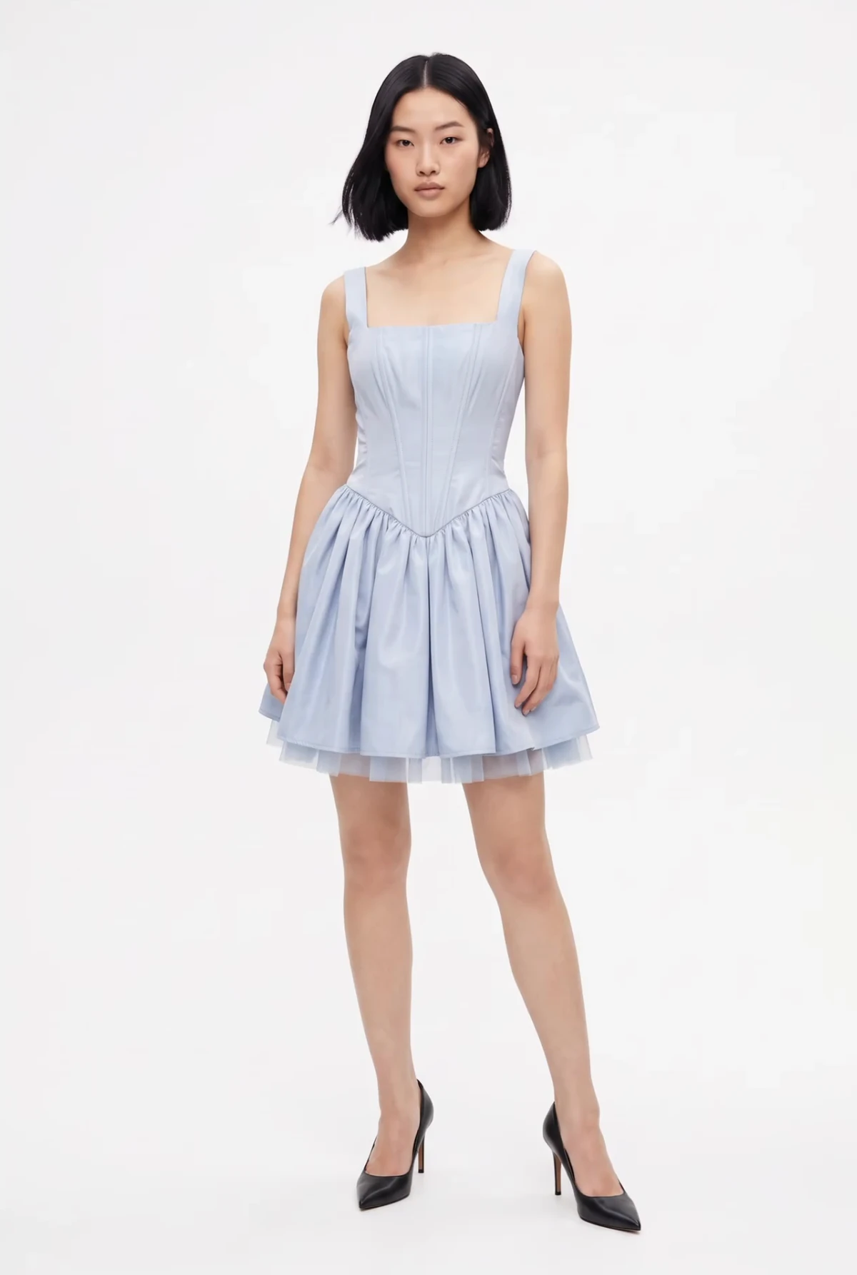 The model wearing the light blue corset dress from the flat-lay photo