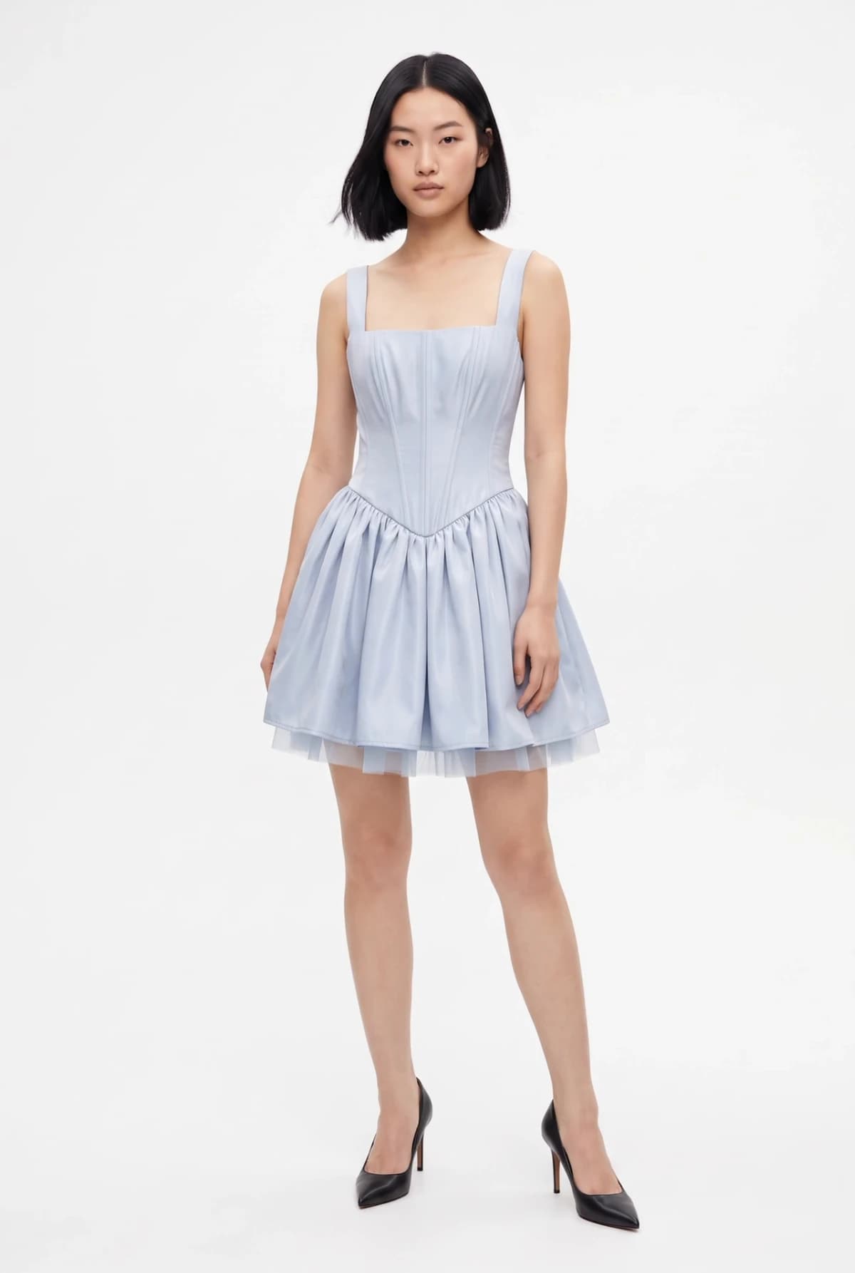 The model wearing the light blue corset dress from the mannequin photo