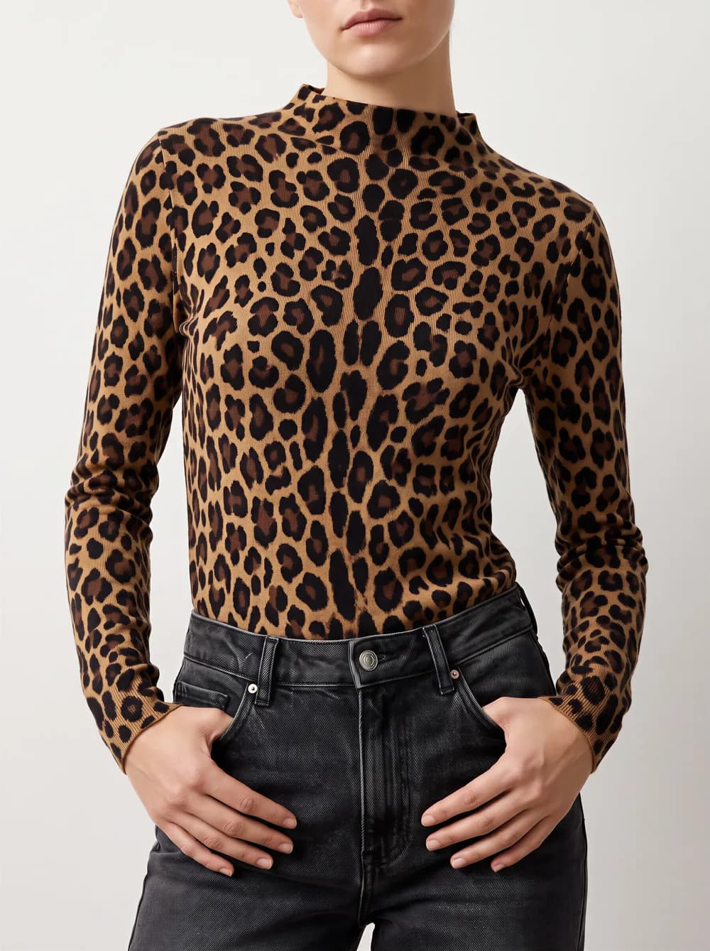 Product photo: a woman wearing a leopard print mock neck top